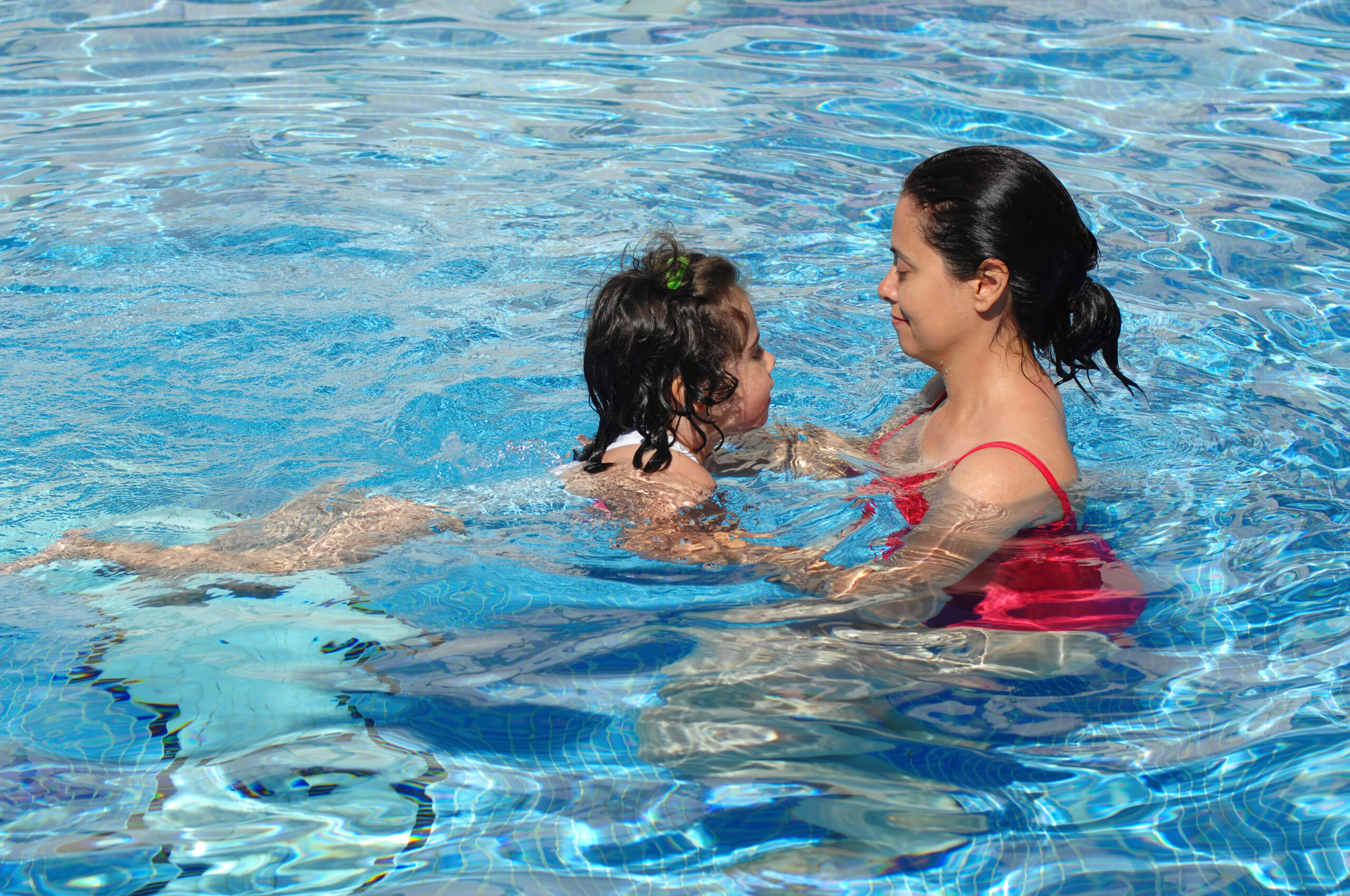 Image of Woman and Child Swim Less
